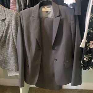 Women’s grey and white pin stripe pant suit